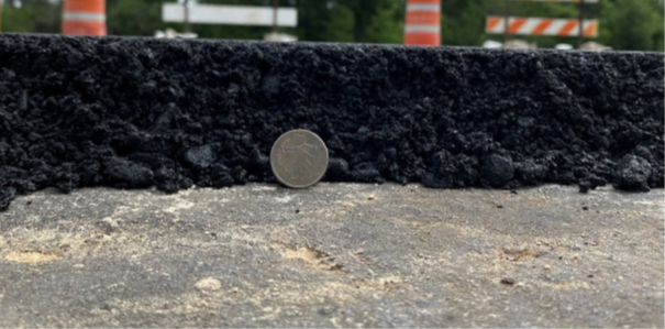 April 2025 field trial with Wetfix® G400 on US Highway 98 in Pasco County, FL: 2.5-3 inches (6-8 cm) of Warm Mix Asphalt (WMA) were paved on a granular base. Picture courtesy of Nouryon